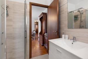 a bathroom with a sink and a mirror at Maison Du Soleil - Bien-être in Saint Vincent +26 photos