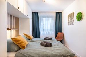 a bedroom with two beds with pillows on it at Fewo Am Feldberg Gipfel in Feldberg