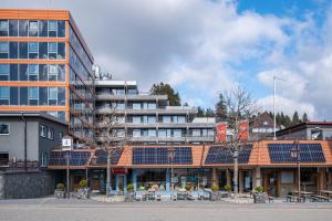 a building with lots of solar panels on its roof at Fewo Am Feldberg Gipfel in Feldberg