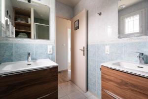 a bathroom with a sink and a mirror at Gîte De L'enclume in Sévignac +15 photos