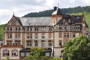 an old building with a clock tower on top of it at Gasthaus in Bernkastel-Kues
