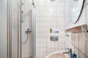 a bathroom with a shower and a sink at Gasthaus in Bernkastel-Kues +45 photos
