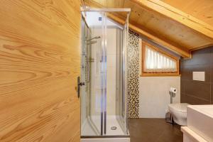 a bathroom with a shower and a toilet at Mas Di Zonadi in Rabbi +66 photos