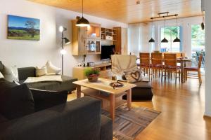 a living room with a couch and a table at Sonnerhof Hofsgrund in Oberried