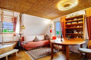 a living room with a couch and a table at Das blaue Haus in Pfullendorf