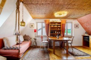 a living room with a couch and a table at Das blaue Haus in Pfullendorf +14 photos