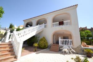 a large white house with stairs and a balcony at Casa Papa in San Fulgencio