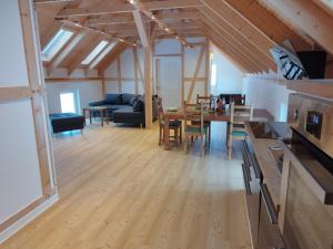 a living room with a table and a dining room at Kleine Auszeit 1 in Forst