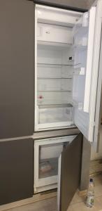 an empty refrigerator with its door open at Waldhaus Hempe in Tabarz