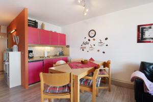 a kitchen and dining room with a table and chairs at Ferienwohnung Manuela in Sankt Englmar