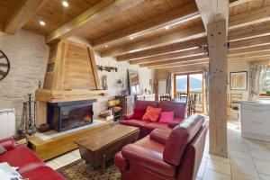 a living room with a couch and a fireplace at Maison de village Puyvalador in Puyvalador