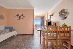 a living room and dining room with a table and chairs at Marazul in Tacoronte