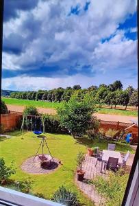 a view of a garden with a playground at Ferienwohnung an der Lahn in Limburg an der Lahn