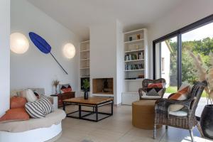 a living room with a couch and a table at Les Hauts de Figha in Conca