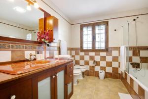 a bathroom with a sink and a toilet and a shower at Casa Glory in Antigua +24 photos