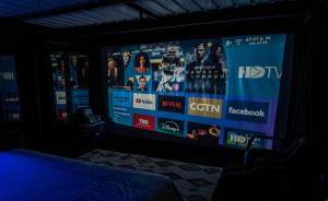 a large screen in a room with a bed at Ecoparque Hotel El Cielo Cabañas in Carmen de Viboral