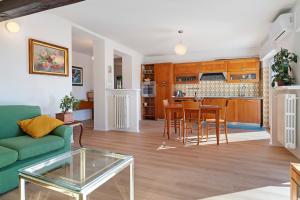 a living room with a couch and a table at The View in Levico Terme