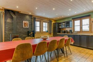 a kitchen and dining room with a table and chairs at Le Flocon Grand Chalet 4 étoiles in Villard-Reculas +28 photos