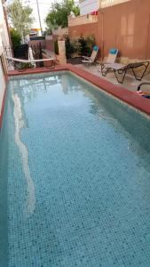 a large blue swimming pool on a building at Casa las Columnas in Capdepera