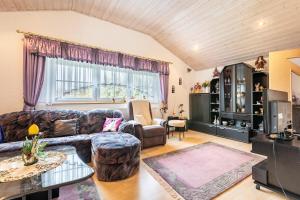 a living room with a couch and a table at Ferienwohnung Plötz in Bad Koetzting