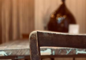 a close up of the back of a wooden chair at Heart Ferienwohnungen Frida I Kahlo in Vogtsburg