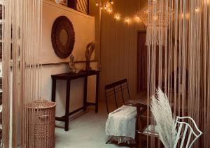 a room with a table and a chair and a mirror at Heart Ferienwohnungen Frida I Kahlo in Vogtsburg