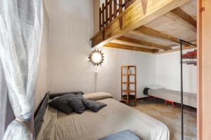a bedroom with a large bed in a room at Antro Di Circe - Orta Centro in Orta San Giulio