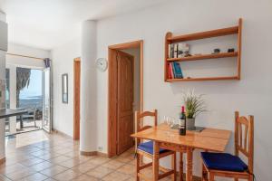 a kitchen and dining room with a table and chairs at Casa Eden in Tías +50 photos