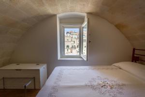Postel nebo postele na pokoji v ubytování Casamata Matera