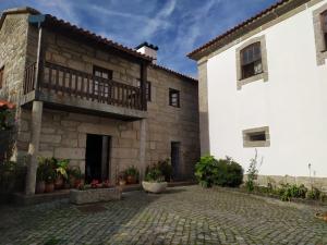 an exterior view of a building with a balcony at Casa do Adro do Soajo in Soajo