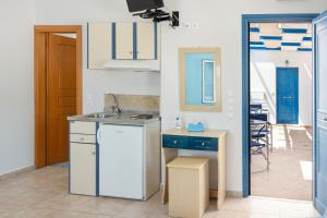 a kitchen with a sink and a counter top at Studios Ninemia Serifos 4 in Livadi +12 photos
