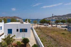 a white house with a view of the water at Studios Ninemia Serifos 4 in Livadi