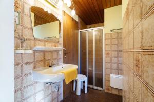 a bathroom with a sink and a shower at Pension Haus Rose in Oberharmersbach +106 photos