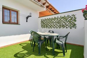 a dining room with a table and chairs at Casa Murillo in Nerja