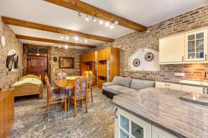 a kitchen and living room with a couch and a table at Ferienwohnungen Bunge in Krostitz