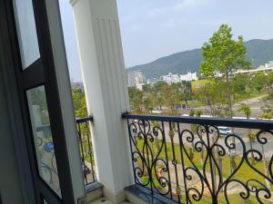 a balcony with a view of a city at Queen-Hotel in Quy Nhon +30 photos