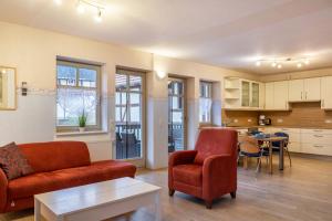 a living room with a couch and chairs and a table at Ferienwohnung 1 Hof Schäfer in Waldeck
