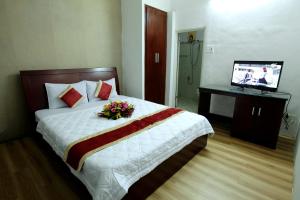 Postel nebo postele na pokoji v ubytování Tan Da Hotel