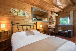 a bedroom with a bed and a chair in a room at Entre Viejos Olivos in Benicolet +192 photos
