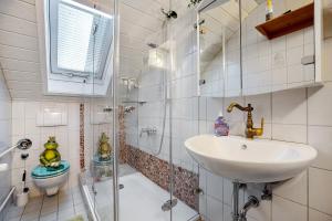 a bathroom with a sink and a toilet at Comic Fantasy in Lindau +14 photos