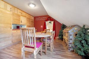 a dining room with a table and two chairs at Comic Fantasy in Lindau