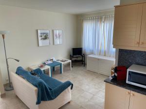 a living room with a couch and a table at Apartment Niceview in Alaior