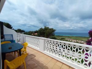 a balcony with a view of the ocean at Apartment Niceview in Alaior