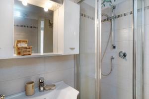 a bathroom with a sink and a shower at Casa di Ali in Imperia +14 photos