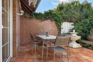 a table and chairs sitting on a patio at Ferienhaus Jadeblick I I in Dangast