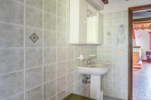 a bathroom with a sink and a mirror at Il Serrino 5 in Pistoia +28 photos