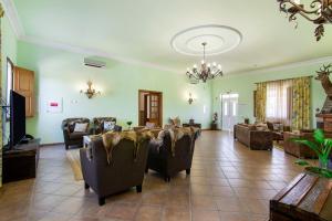 a large living room with couches and chairs in it at Casas do Monte in Giões