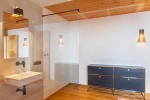 a bathroom with a sink and a mirror at Chalet Flocke Appart Murmeltier in Sankt Anton am Arlberg