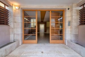 an entrance to a building with glass doors at Villafranca in Alghero