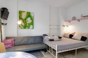 a living room with a couch and a table at Studio-in der atelierhaus Loft in Bodman-Ludwigshafen